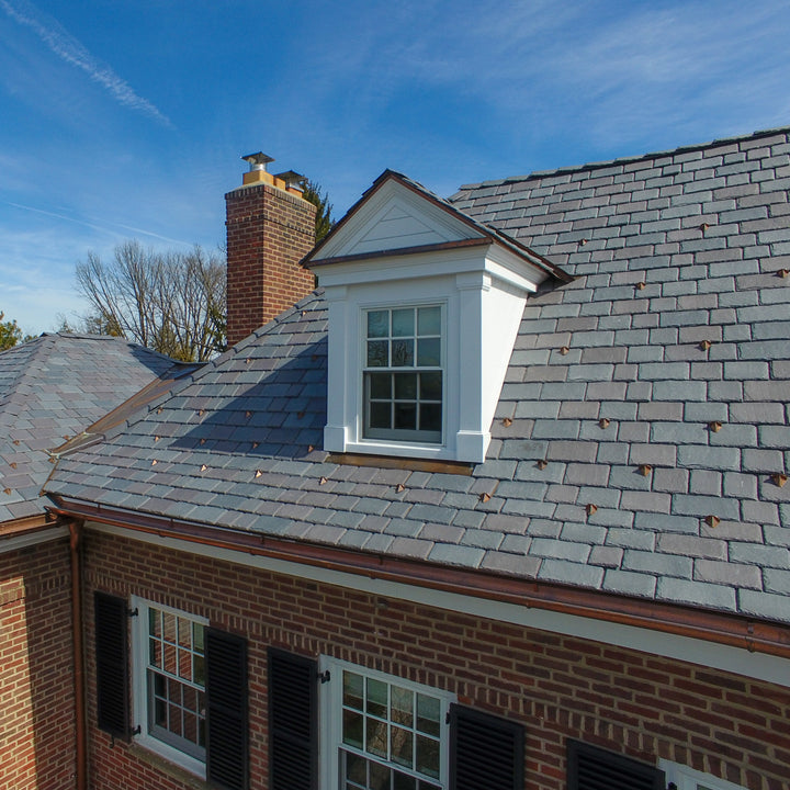 PD10 pad-style snow guards installed on natural slate.